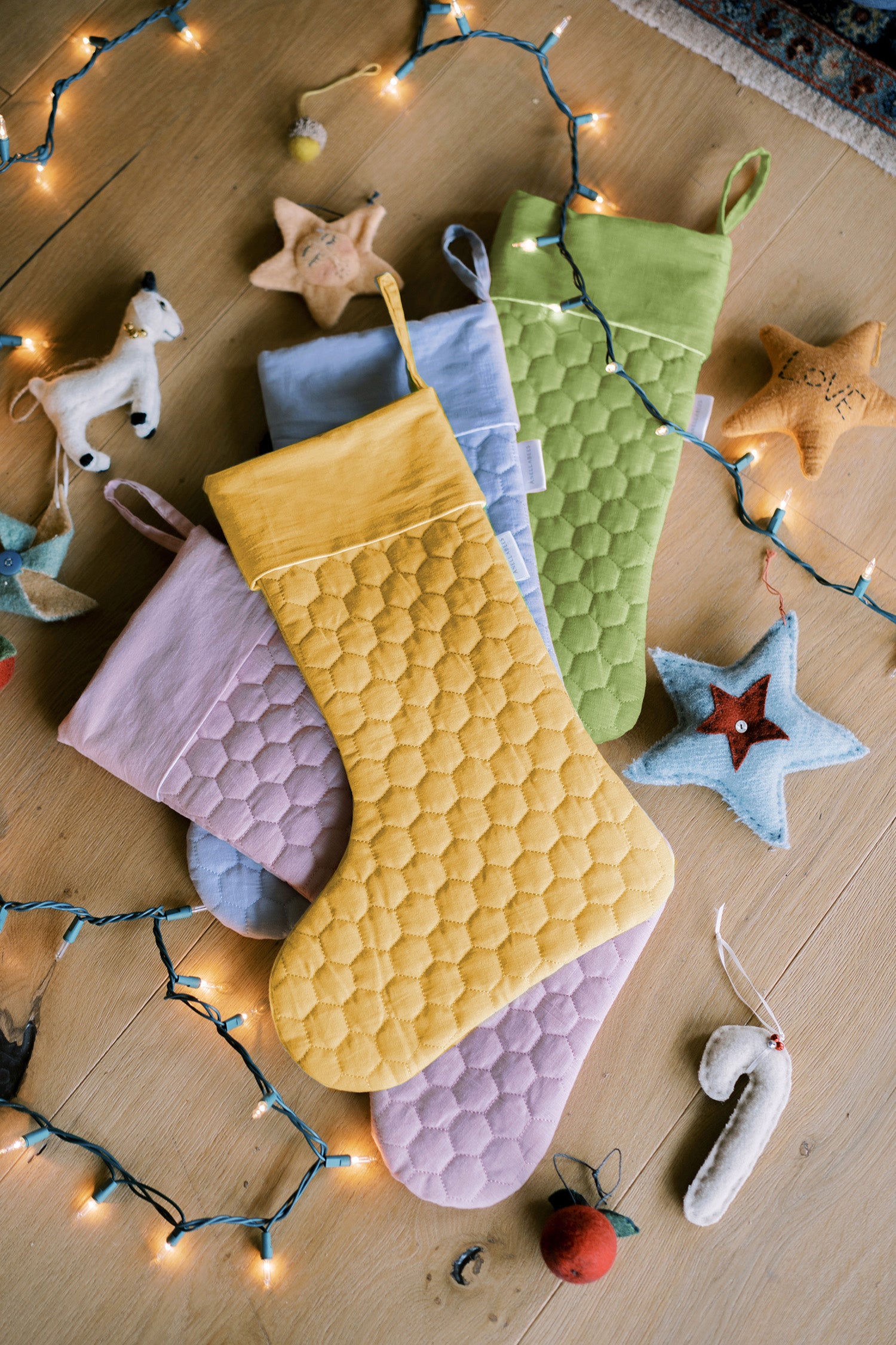 Save the Bees holiday stockings with linen hexagon design, eco-friendly bee-themed, perfect for Christmas gifting, supporting pollinator conservation.