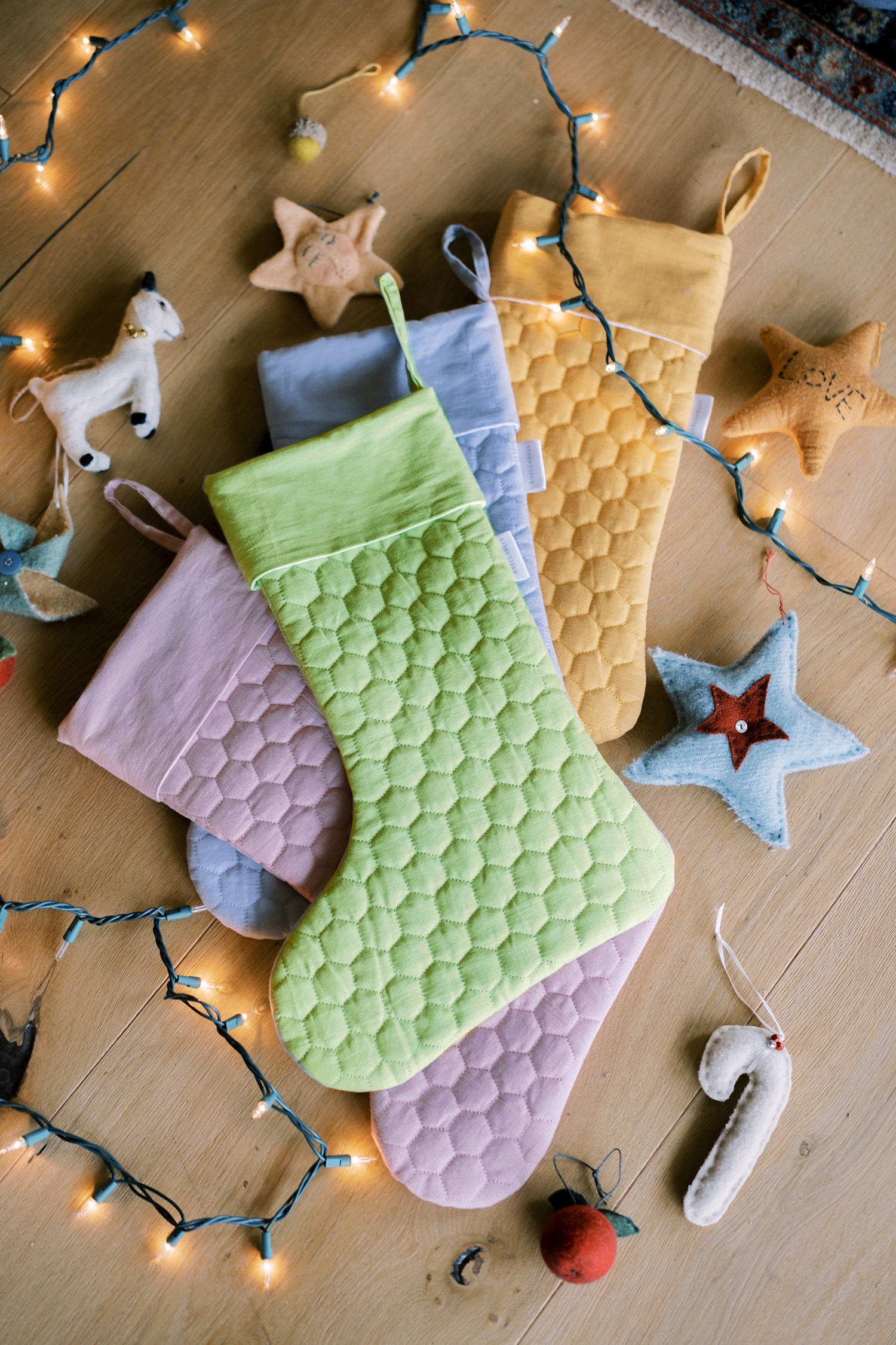 Save the Bees holiday stockings with linen hexagon design, eco-friendly bee-themed, perfect for Christmas gifting, supporting pollinator conservation.