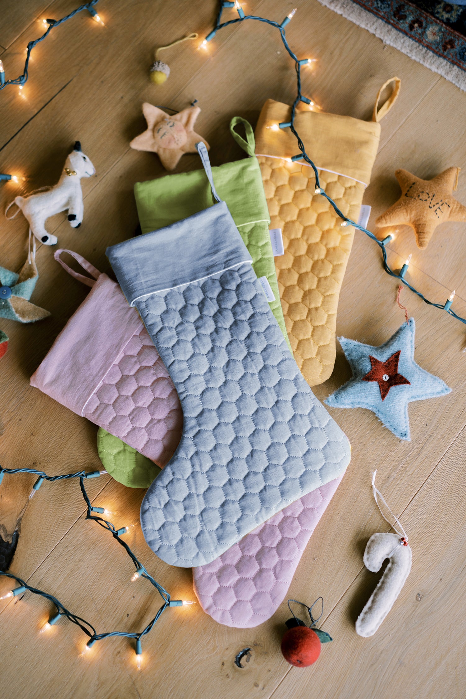 Save the Bees holiday stockings with linen hexagon design, eco-friendly bee-themed, perfect for Christmas gifting, supporting pollinator conservation.