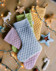 Save the Bees holiday stockings with linen hexagon design, eco-friendly bee-themed, perfect for Christmas gifting, supporting pollinator conservation.