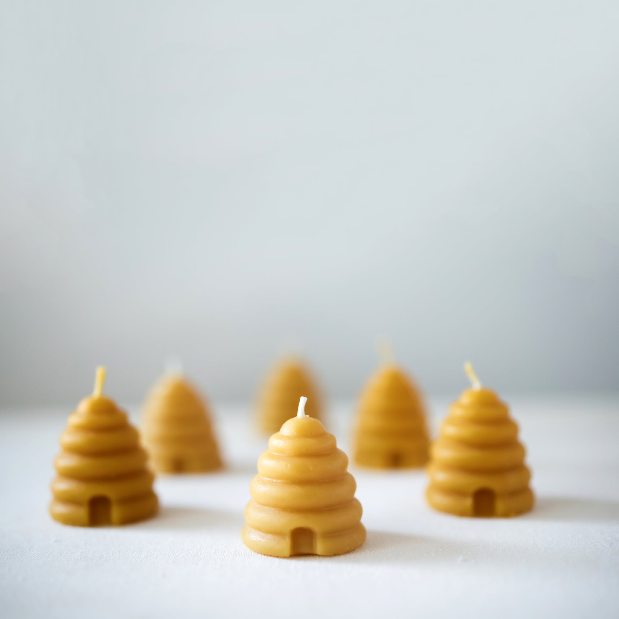 Hand-poured beeswax votive candles, natural, eco-friendly, made from 100% pure beeswax, non-toxic and sustainable, and proudly made in the USA.