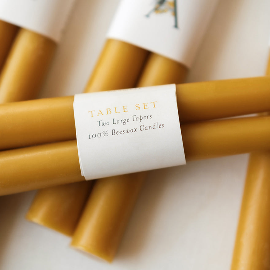 Hand-dipped beeswax taper candles, natural and eco-friendly, made from 100% pure beeswax, non-toxic, sustainable, and proudly made in the USA.