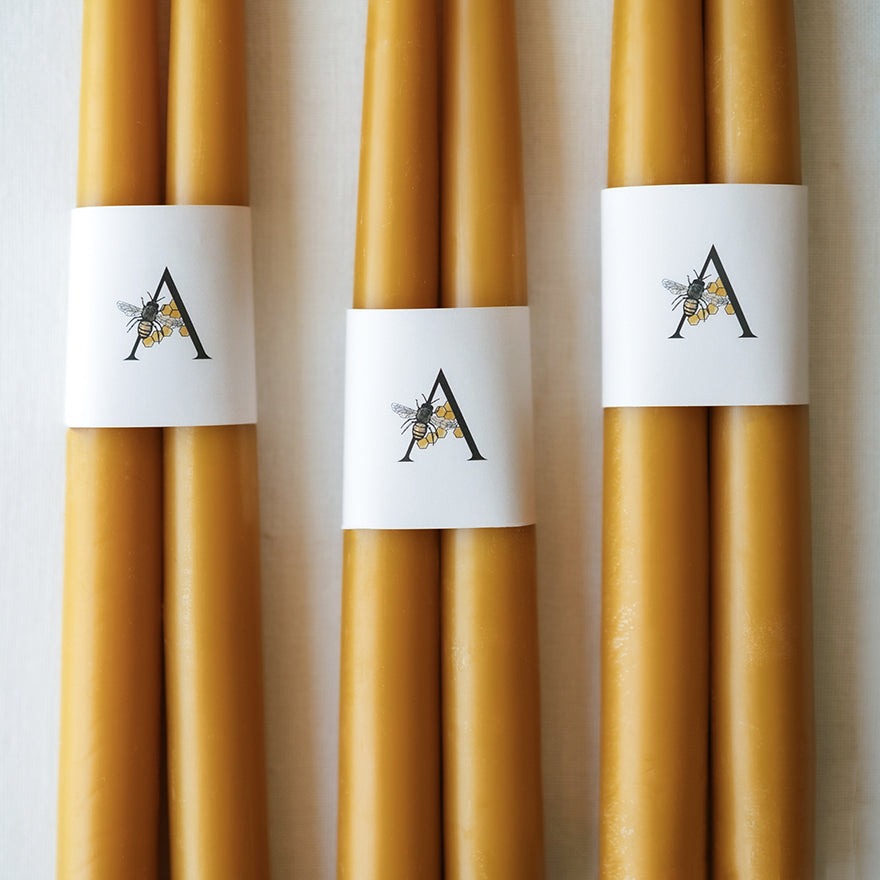 Hand-dipped beeswax taper candles, natural and eco-friendly, made from 100% pure beeswax, non-toxic, sustainable, and proudly made in the USA.
