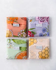 Reusable shopping tote bag with colorful flower patterns, eco-friendly, durable for shopping and farmers markets, sustainable, stylish, helps the planet.