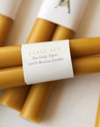 Hand-dipped beeswax taper candles, natural and eco-friendly, made from 100% pure beeswax, non-toxic, sustainable, and proudly made in the USA.